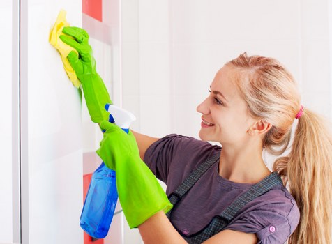 After builders cleaning service removing dust in an Elephant and Castle property
