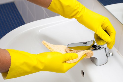 End of tenancy cleaning tasks in a modern South London kitchen